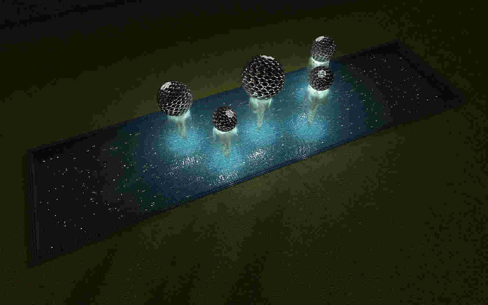 Fishball fountain made of cast bronze fish spheres, with water running through it