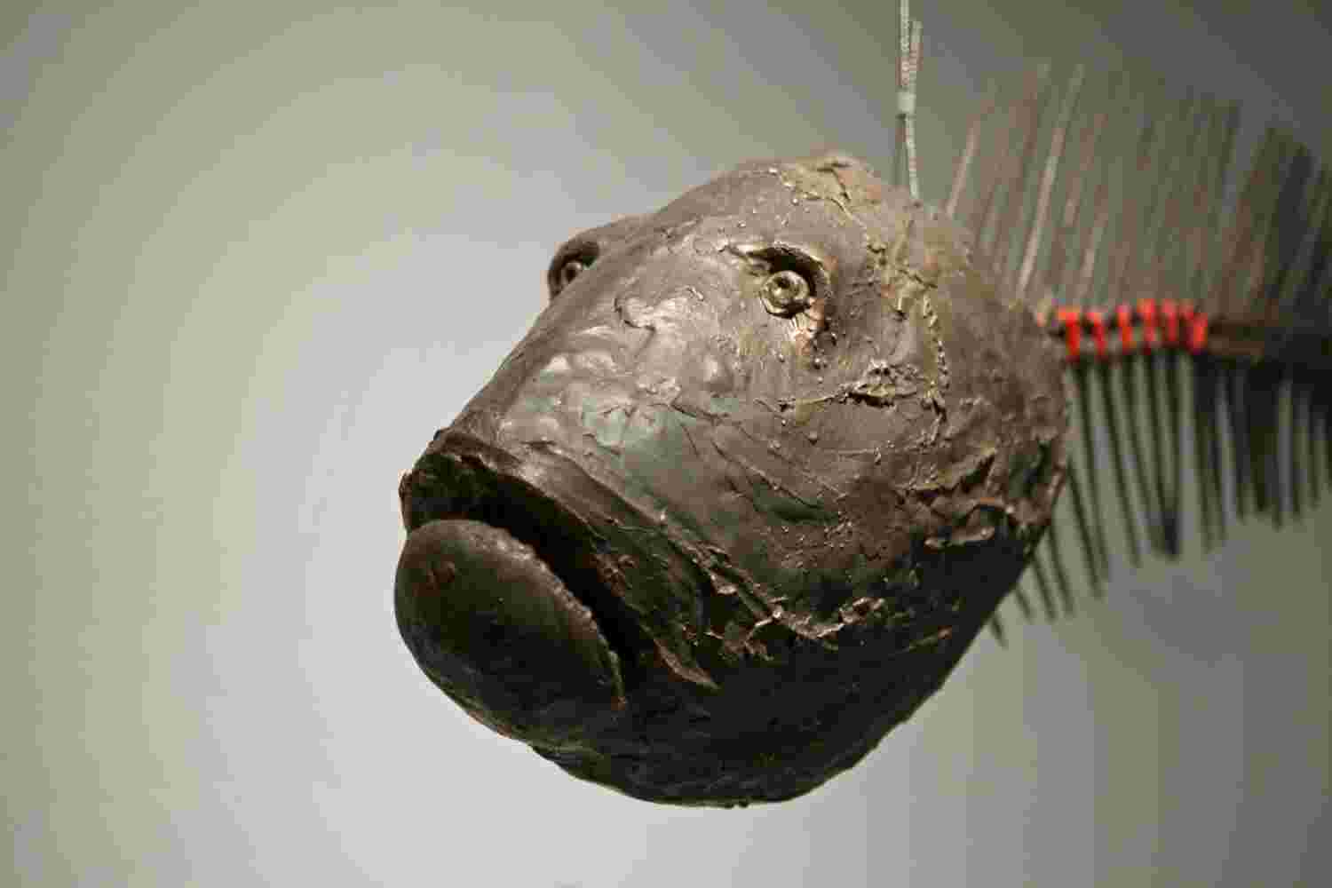 Fishbone Large scale sculpture of a fish bone made of cast bronze and red string