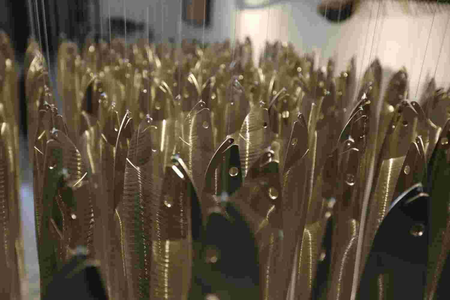 Voice of the sea Large art installation of hanging fish made of stainless steel