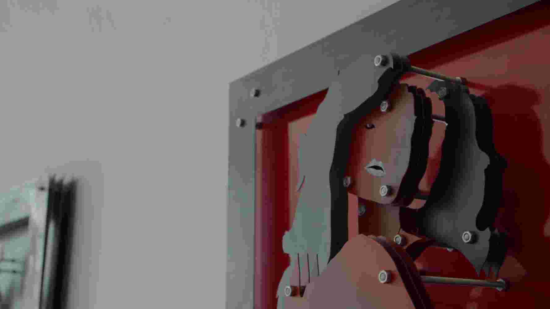 Night Shot Frame Red and black color three-dimensional wall sculpture of a woman made of steel