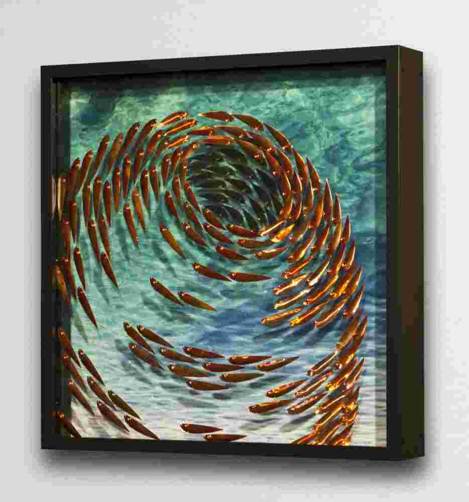 Three-dimensional wall sculpture, school of fish theme, with layers of plexiglass, aluminum frame and swirling copper fish.