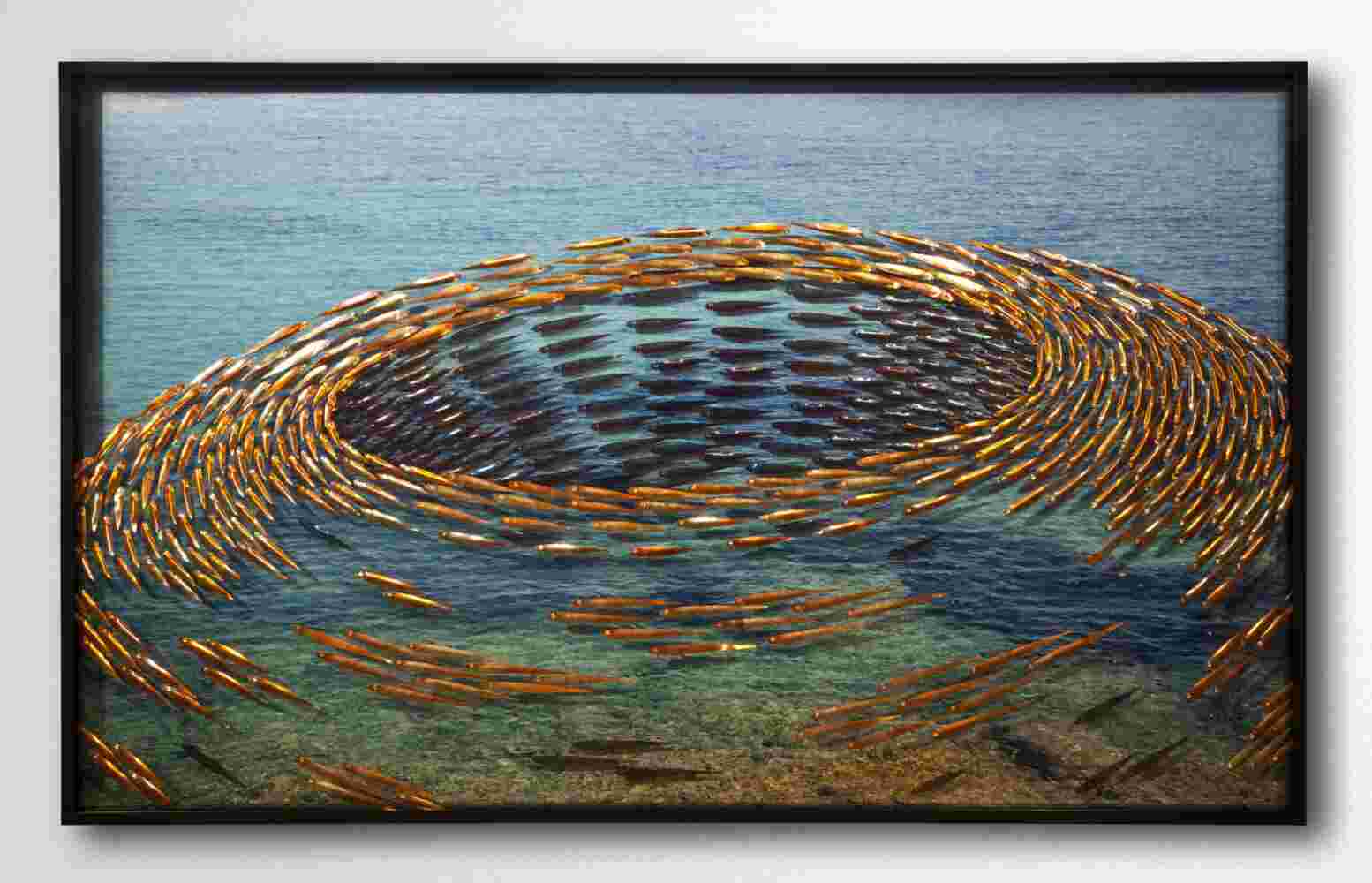 Three-dimensional wall sculpture, school of fish theme, with layers of plexiglass, aluminum frame and swirling copper fish.