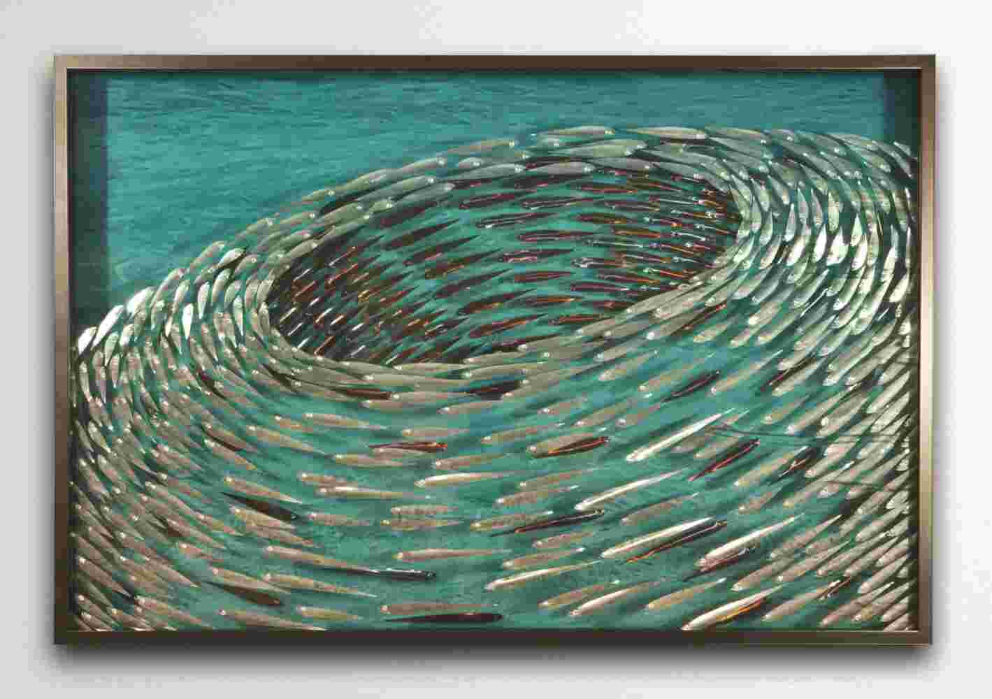 Three-dimensional wall sculpture, school of fish theme, with layers of plexiglass, aluminum frame and swirling metal fish.