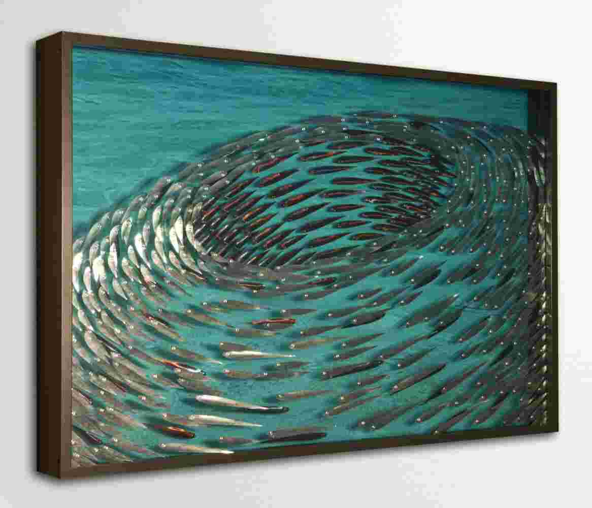 Three-dimensional wall sculpture, school of fish theme, with layers of plexiglass, aluminum frame and swirling metal fish.