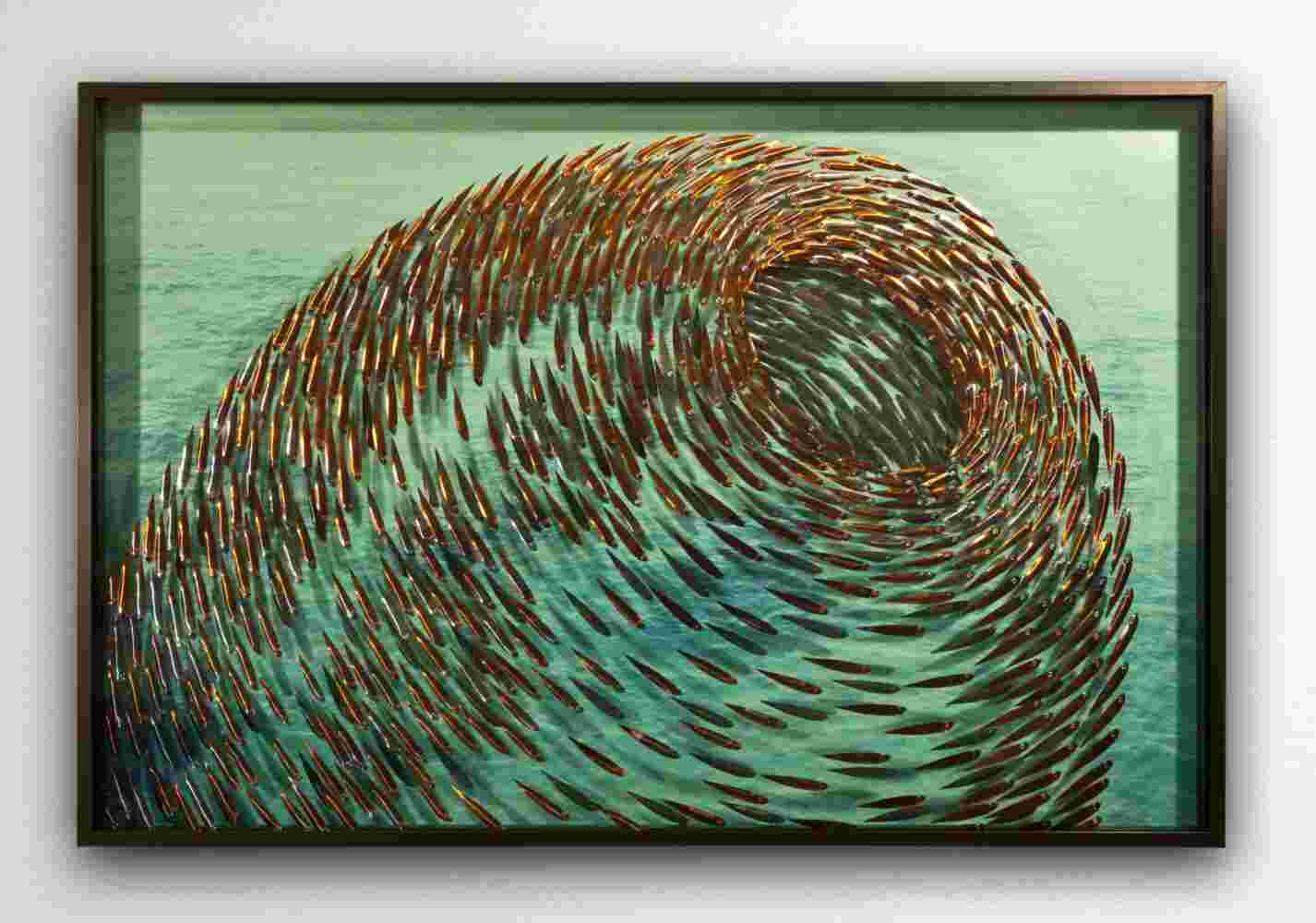 Three-dimensional wall sculpture, school of fish theme, with layers of plexiglass, aluminum frame and swirling copper fish.