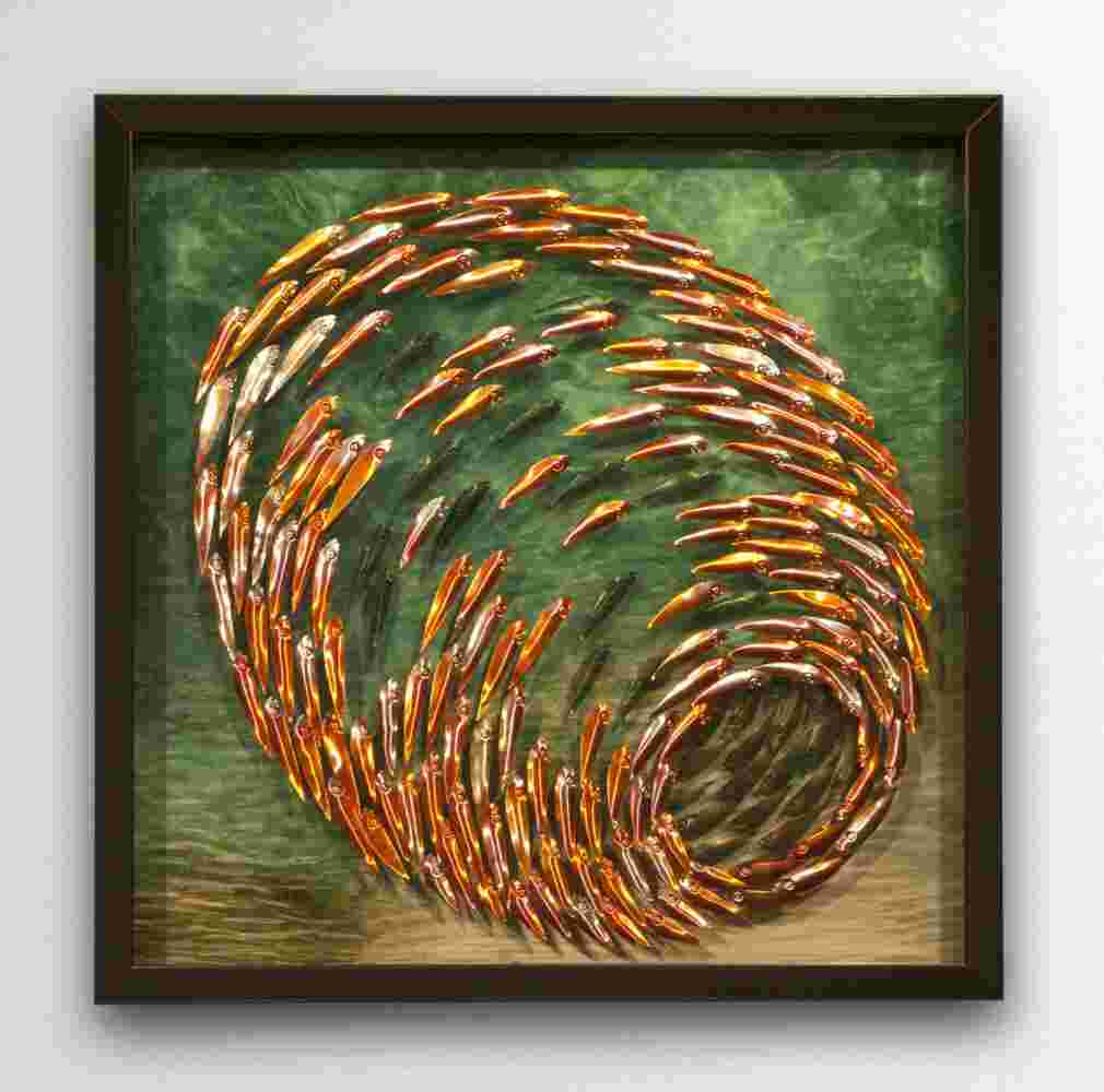 Three-dimensional wall sculpture, school of fish theme, with layers of plexiglass, aluminum frame and spherical copper fish.