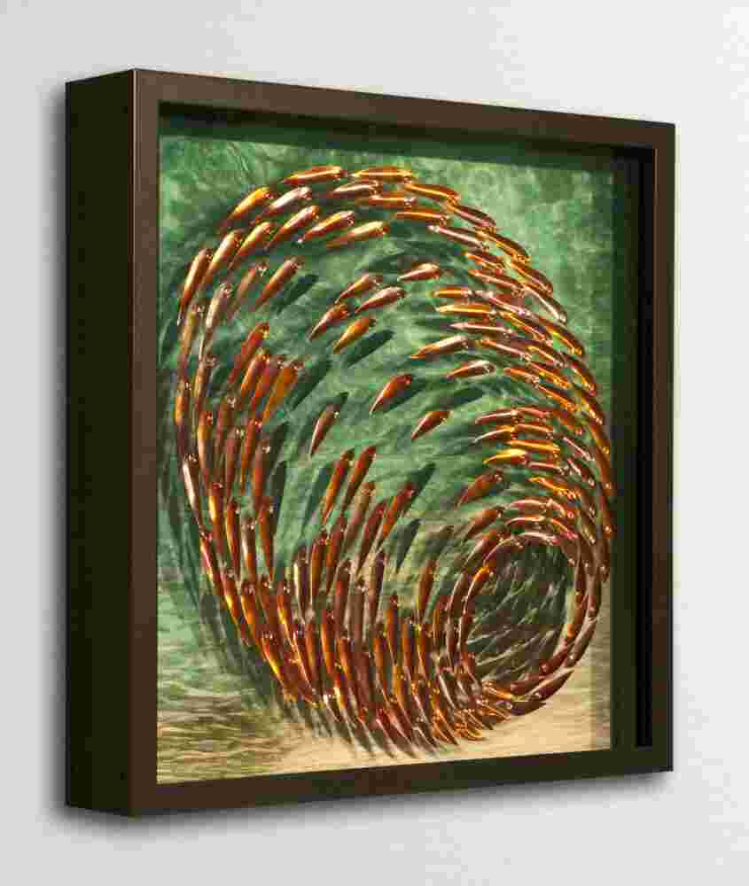 Three-dimensional wall sculpture, school of fish theme, with layers of plexiglass, aluminum frame and spherical copper fish.