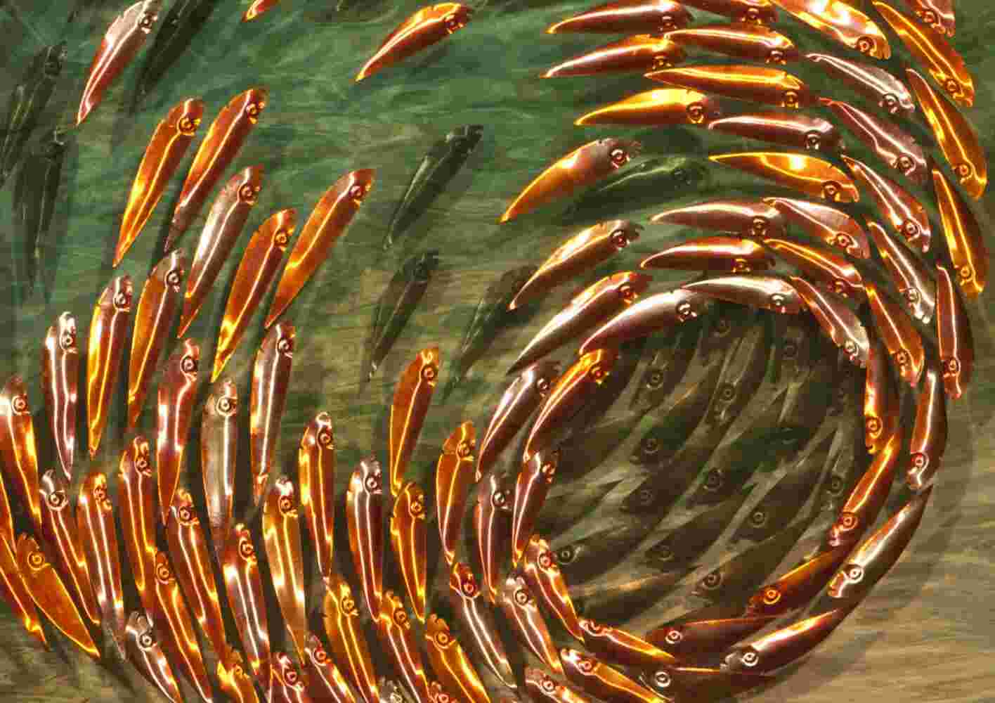 Three-dimensional wall sculpture, school of fish theme, with layers of plexiglass, aluminum frame and spherical copper fish.