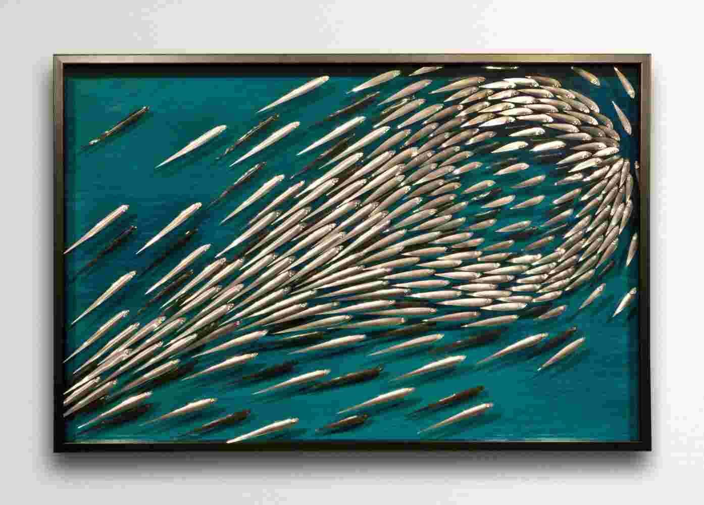 Three-dimensional wall sculpture, school of fish theme, with layers of plexiglass, aluminum frame and explosive copper fish.