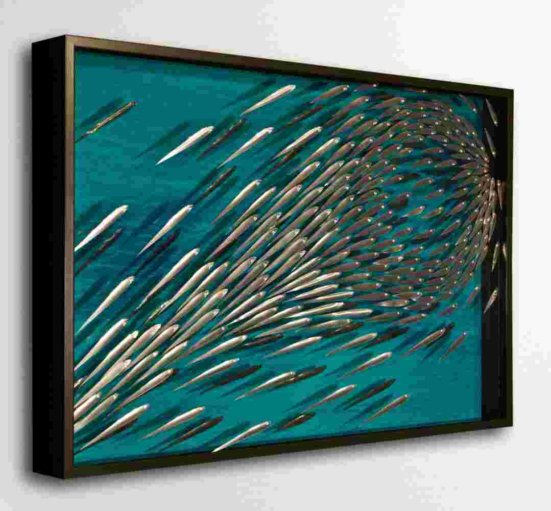 Three-dimensional wall sculpture, school of fish theme, with layers of plexiglass, aluminum frame and explosive copper fish.