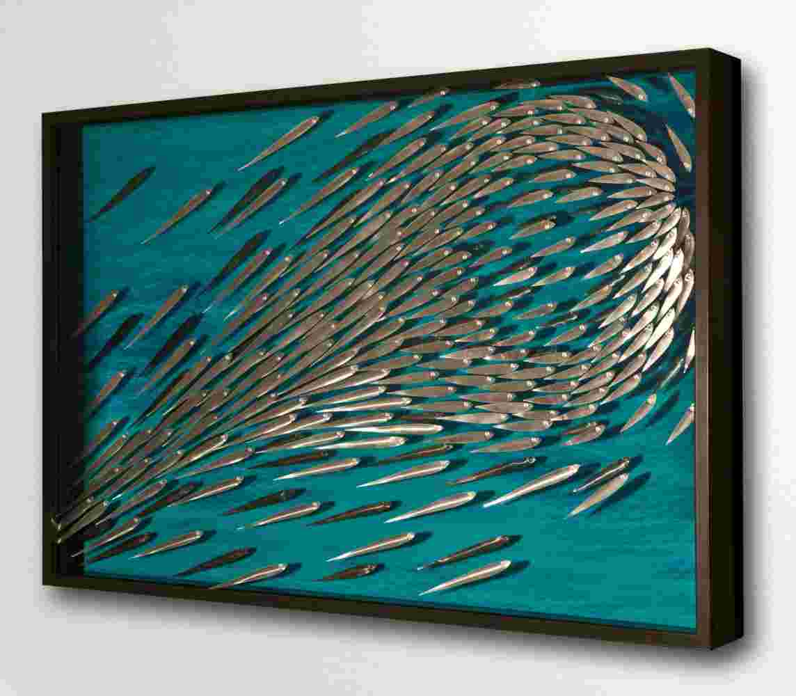 Three-dimensional wall sculpture, school of fish theme, with layers of plexiglass, aluminum frame and explosive copper fish.