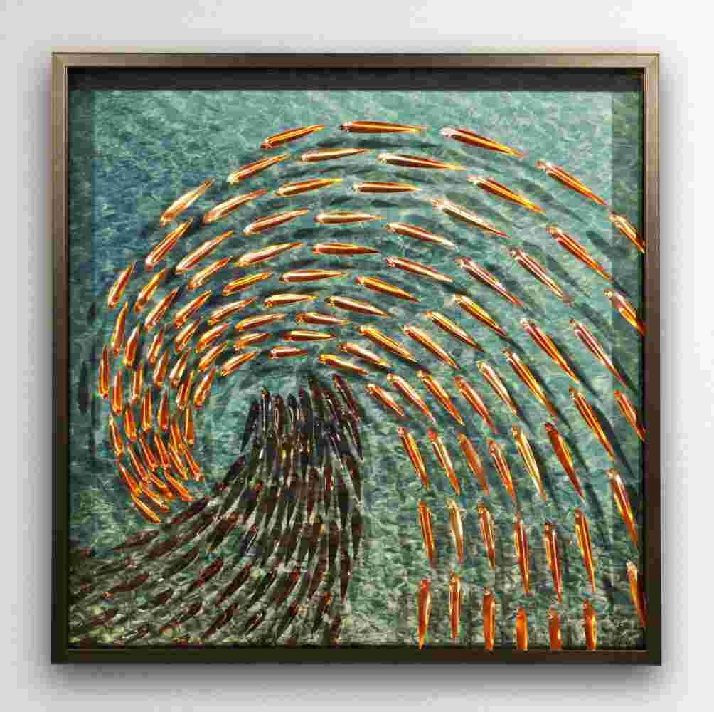 Three-dimensional wall sculpture, school of fish theme, with layers of plexiglass, aluminum frame and a wave of copper fish.