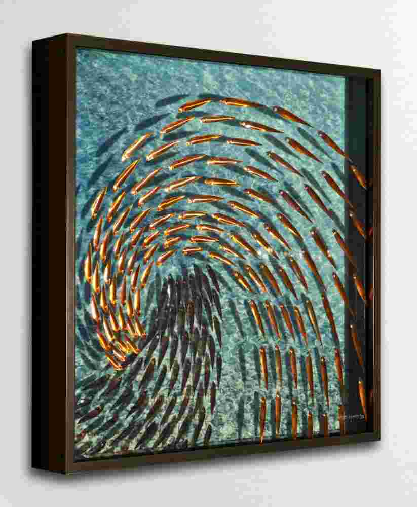 Three-dimensional wall sculpture, school of fish theme, with layers of plexiglass, aluminum frame and a wave of copper fish.