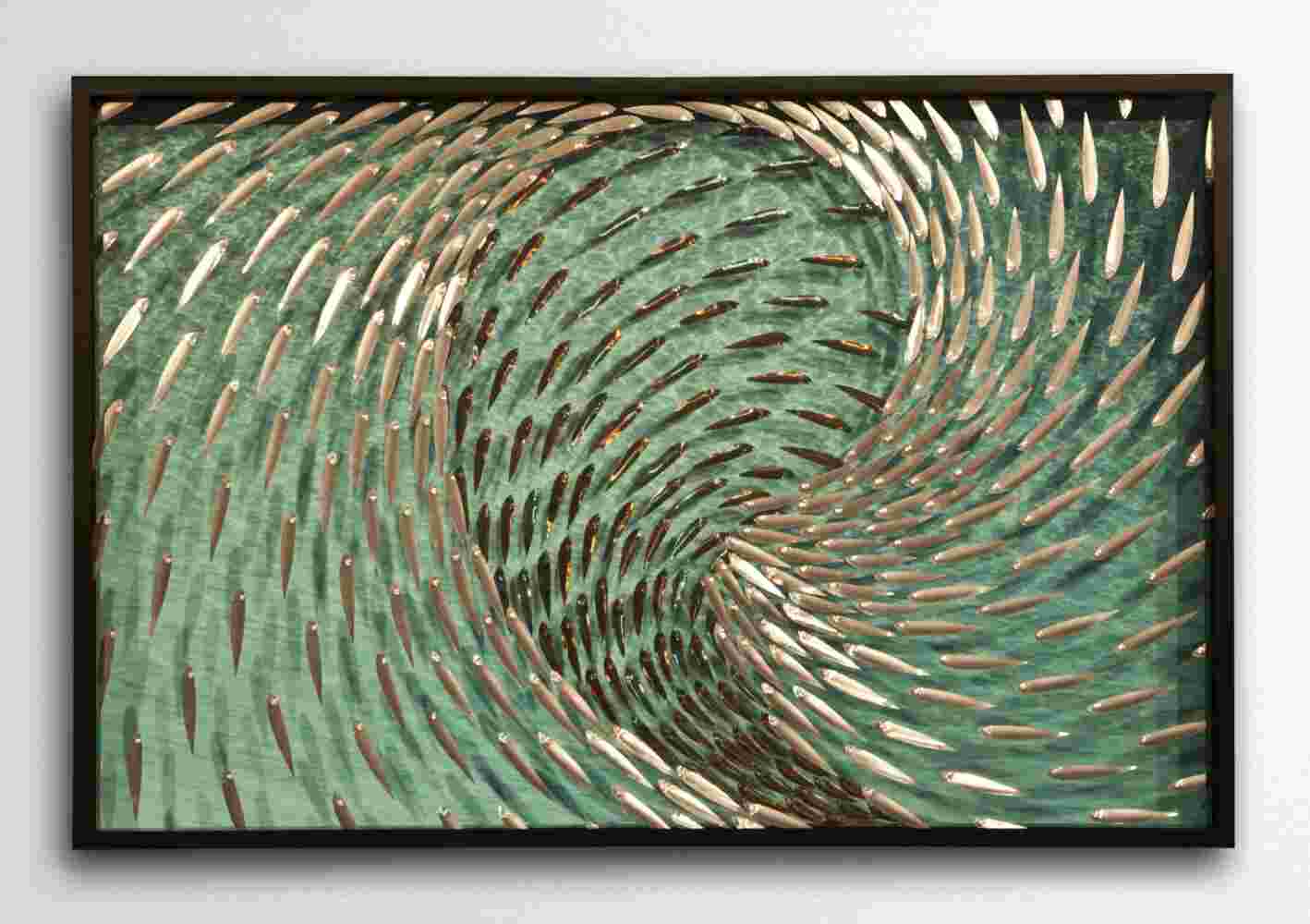 Three-dimensional wall sculpture, school of fish theme, with layers of plexiglass, aluminum frame and swirling aluminum fish.