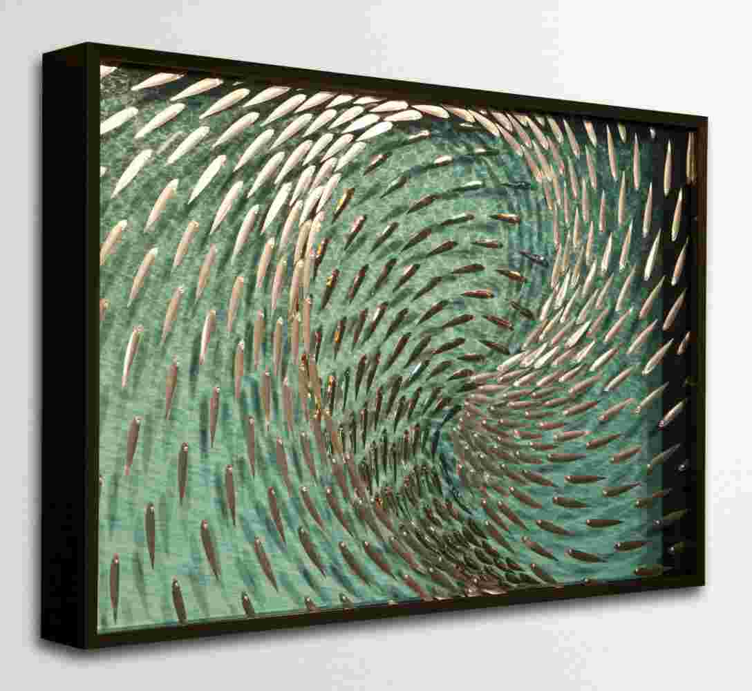 Three-dimensional wall sculpture, school of fish theme, with layers of plexiglass, aluminum frame and swirling aluminum fish.