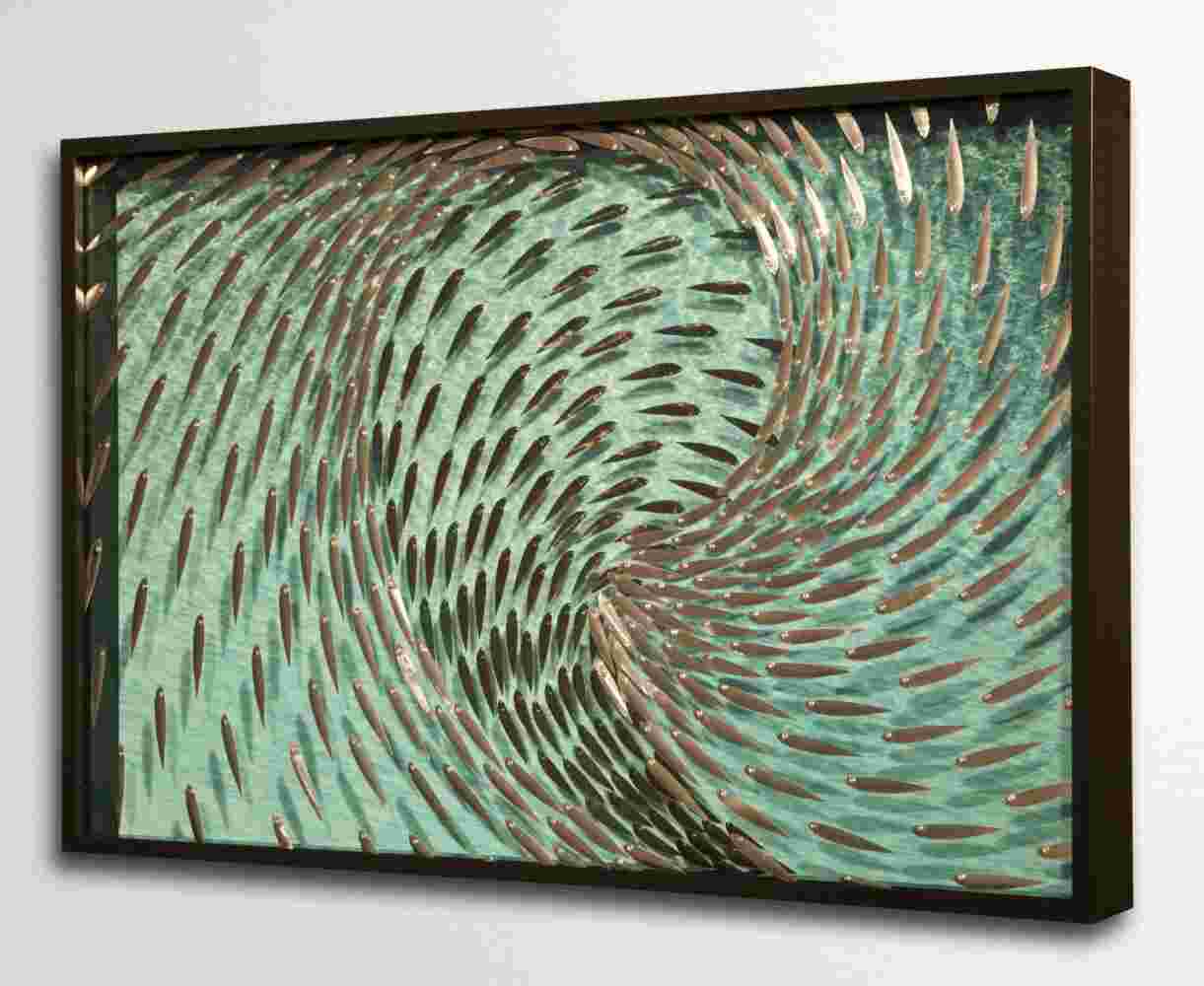 Three-dimensional wall sculpture, school of fish theme, with layers of plexiglass, aluminum frame and swirling aluminum fish.