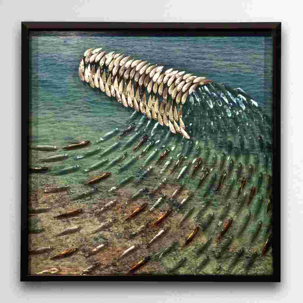 Layered plexiglass artwork of a school of fish