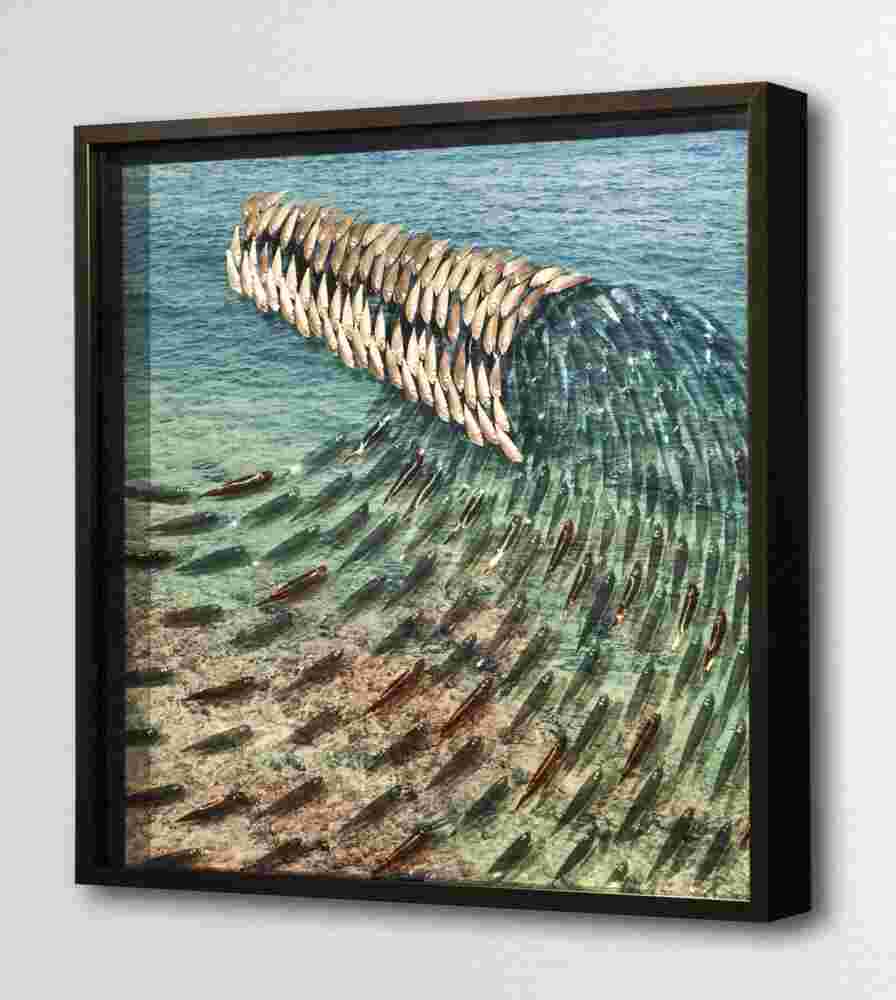 Layered plexiglass artwork of a school of fish