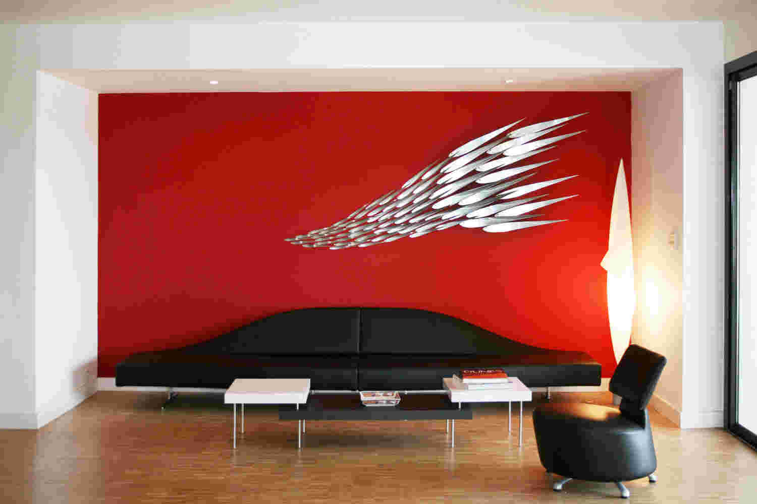 Flowing stainless steel fish wall art