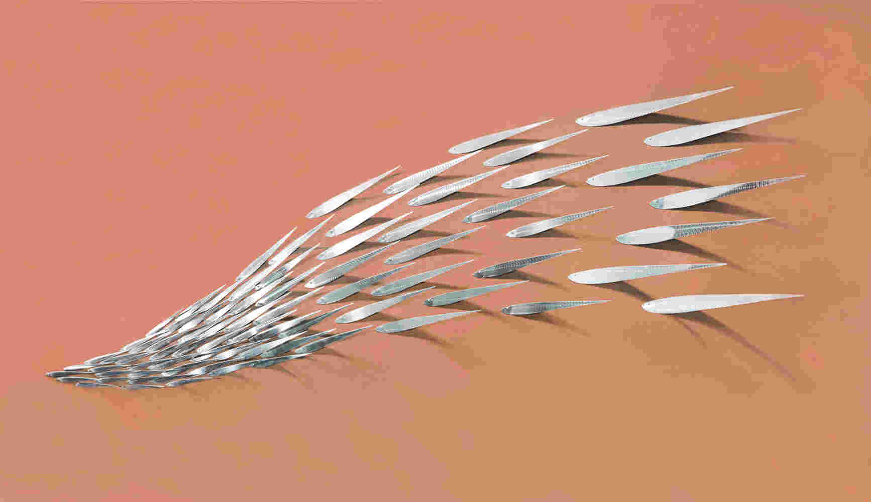 Flowing stainless steel fish art