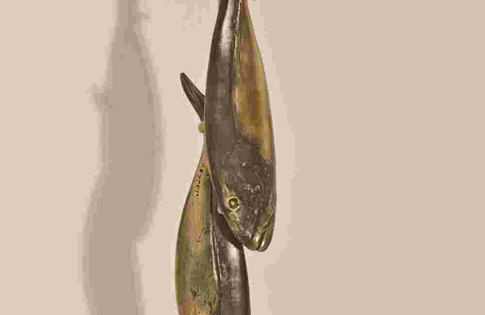 Hanging pair of bronze fish sculptures