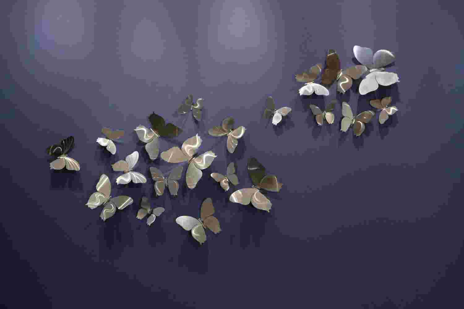 Butterflies silver 20 pieces Wall installation made of 20 pieces of different size stainless-steel butterflies.