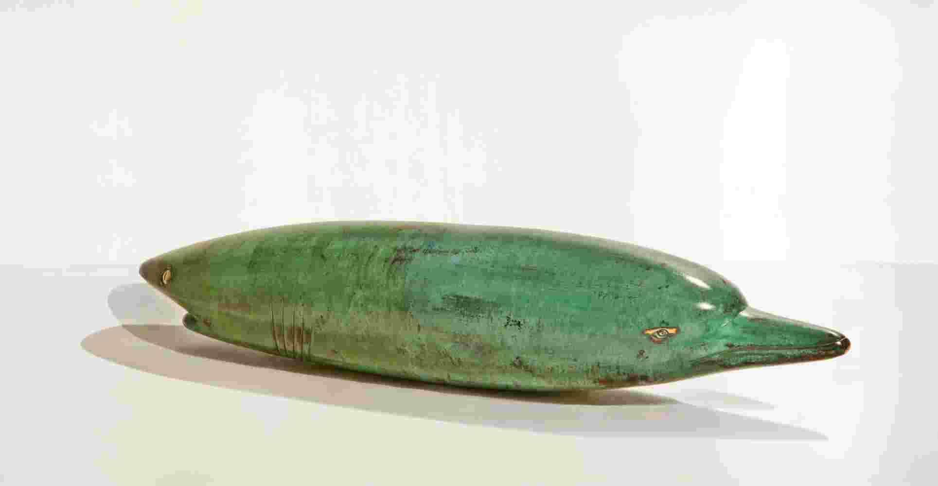 Surrealistic bronze green patina sculpture, half dolphin, half shark