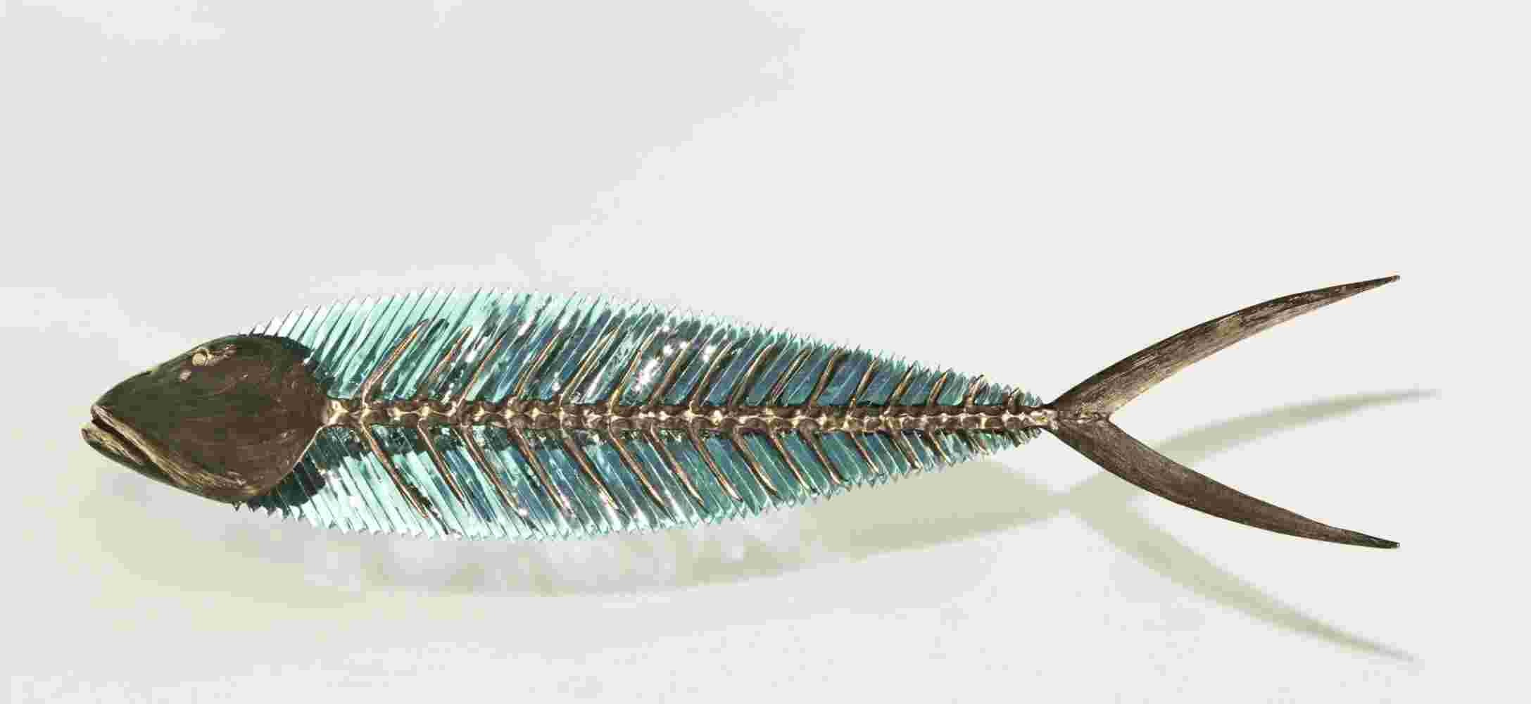 Hand cut glass and bronze wall sculpture of a fish.