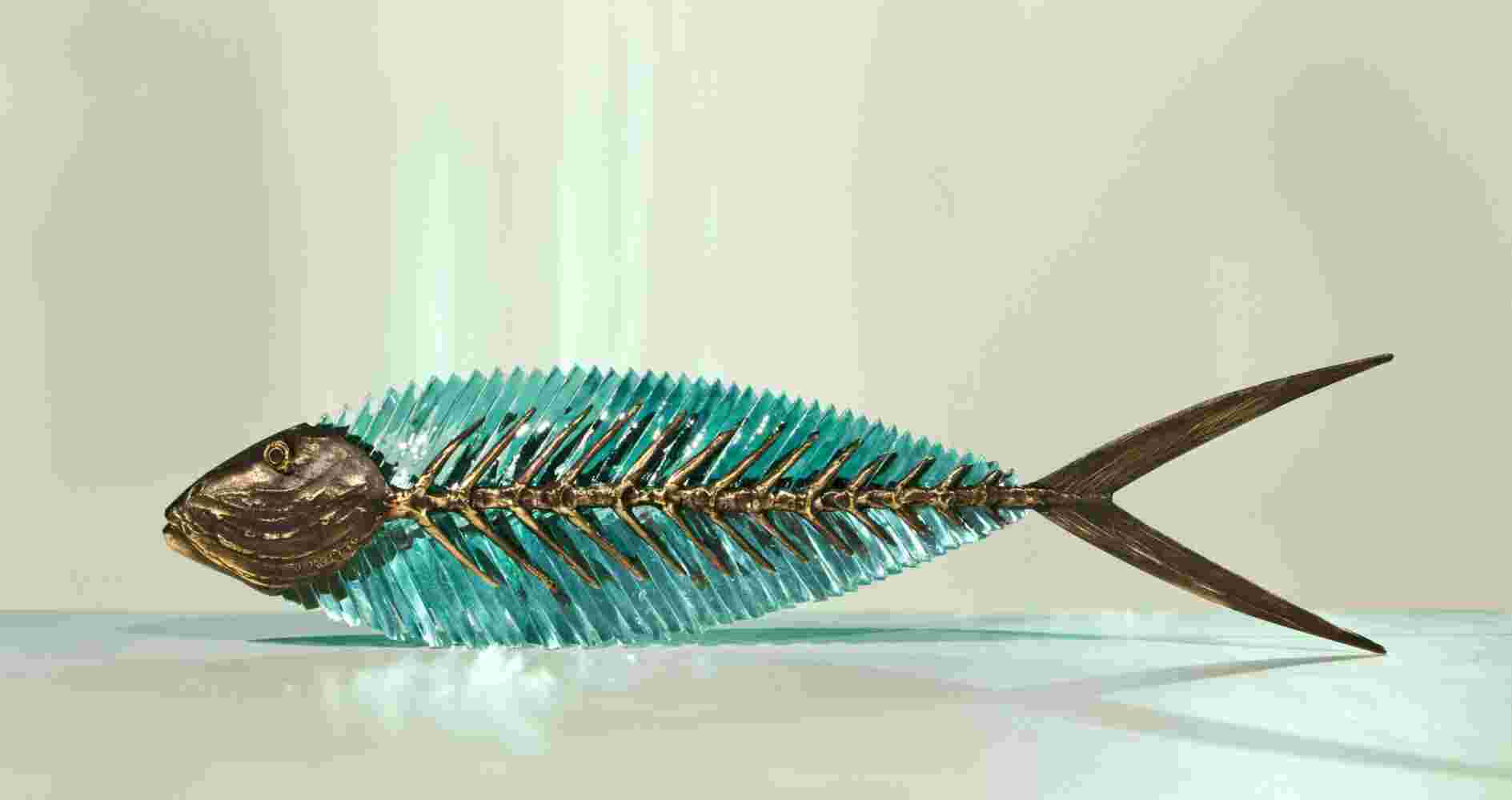 Glass and bronze sculpture of a fish.