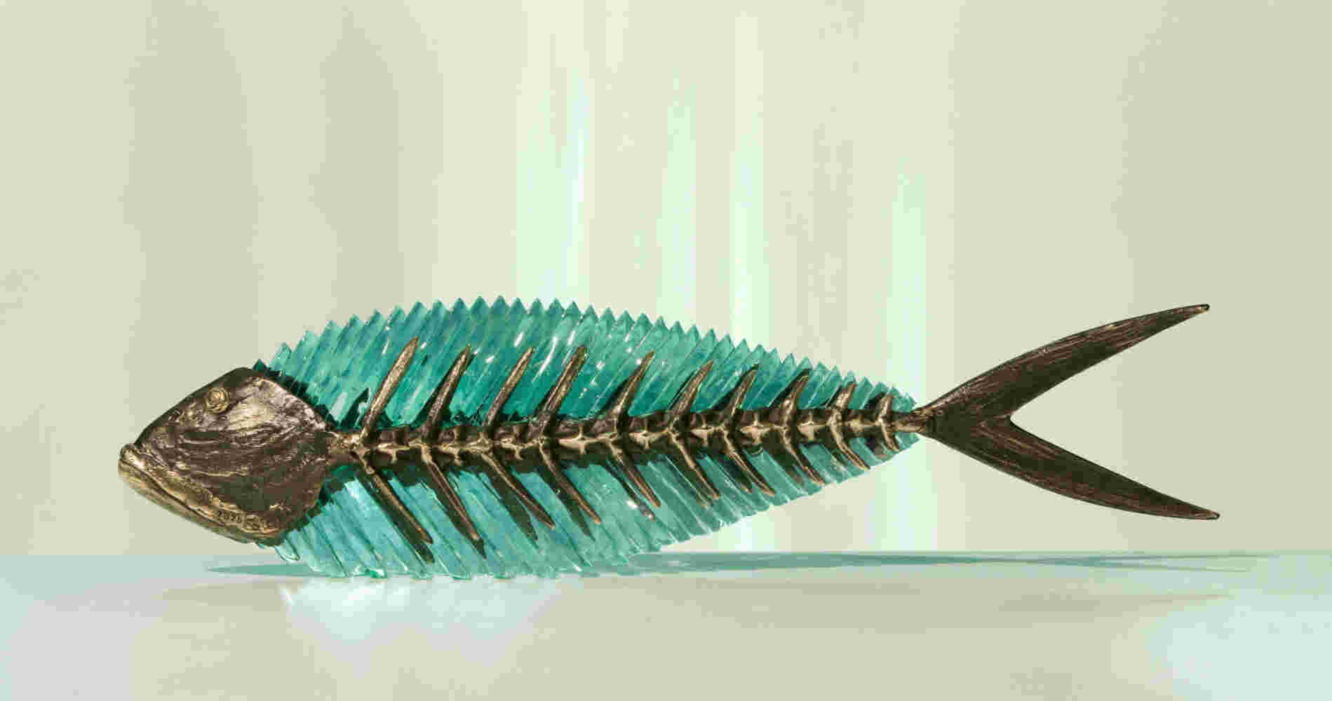 Cast bronze & glass sculpture of a fish. “Frozen Fish”.