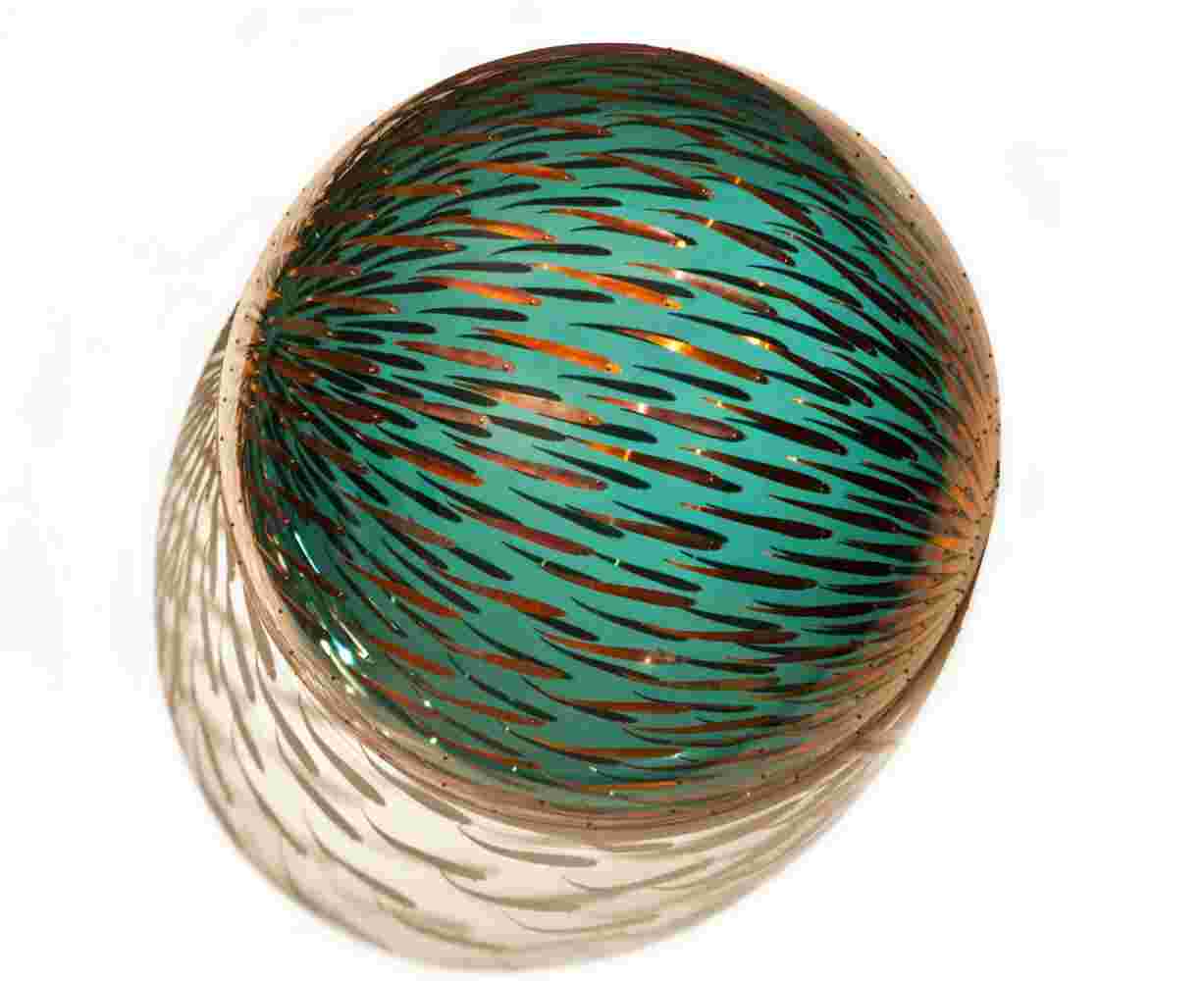 Acrylic hemisphere with metallic fish create a swirling effect that resembles underwater shoals.