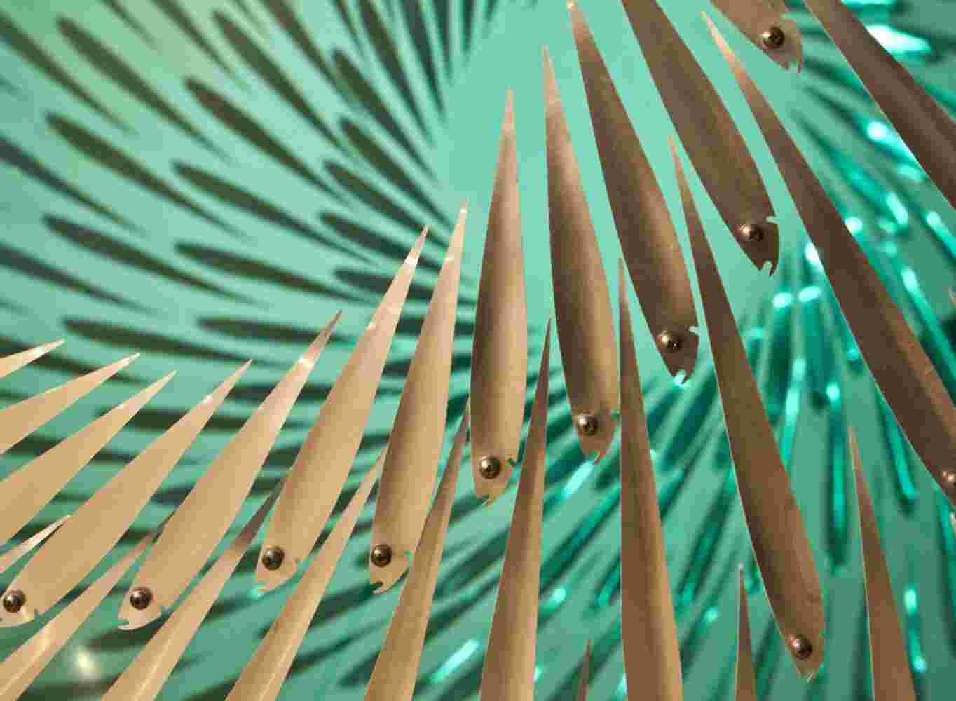 Three-dimensional wall sculpture, school of fish theme, with layers of plexiglass, aluminum frame and a wave of aluminum fish.