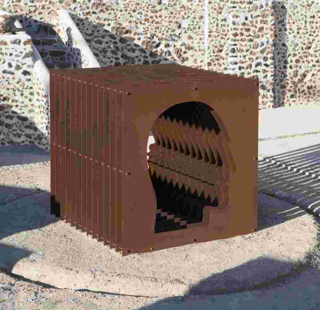 Large-scale exterior art installation – layered face cut-out made from steel.