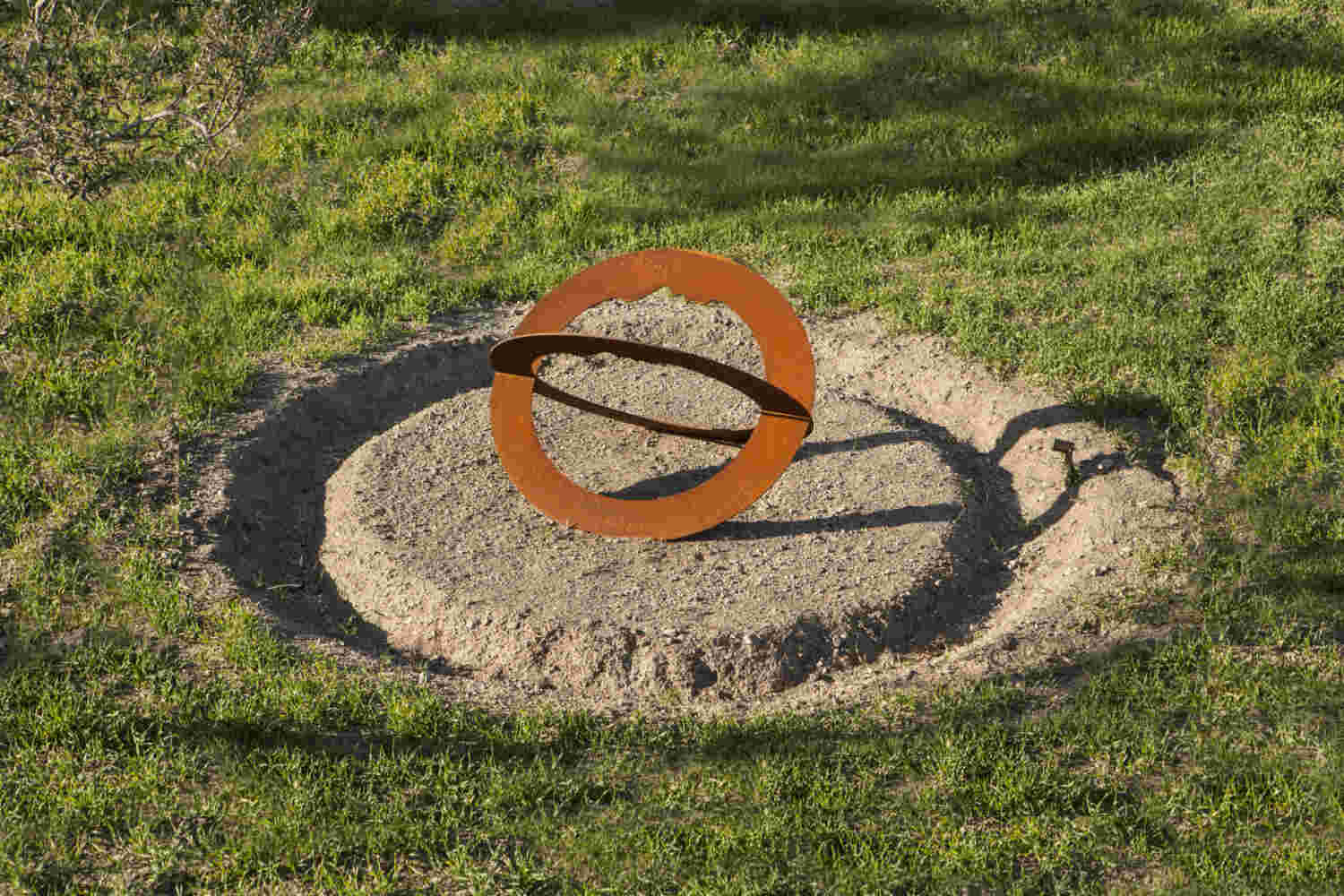 Rusted steel spiral sculpture with the shape of a head