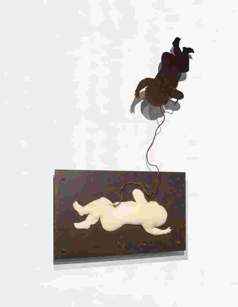 Wall sculpture made of iron and a pillow of a baby flying