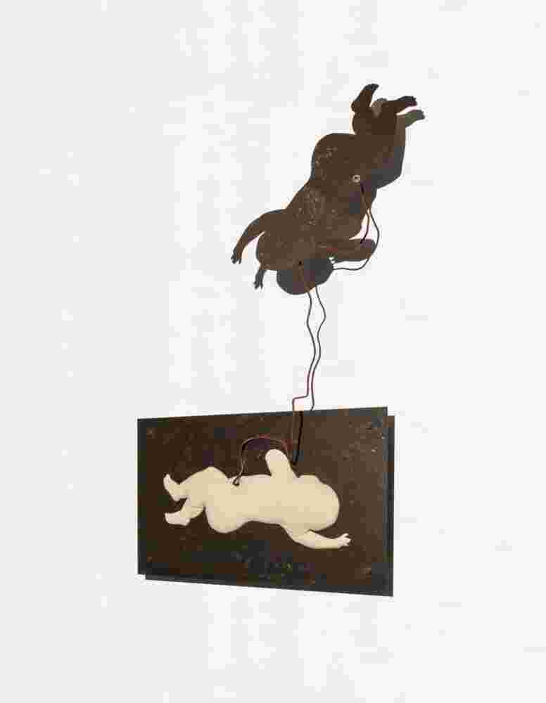 Wall sculpture made of iron and a pillow of a baby flying