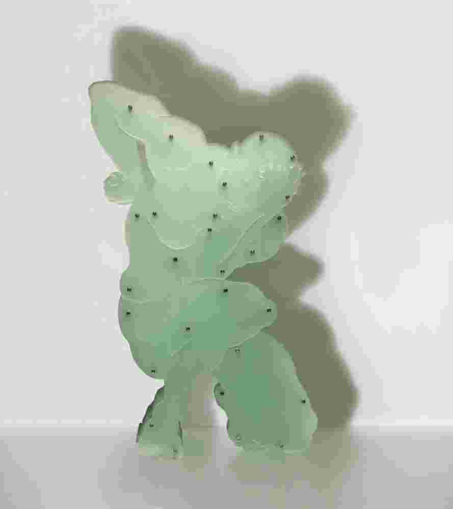 Plexiglass sculpture of a man with multi layers of plexiglass. Thinkers pose.