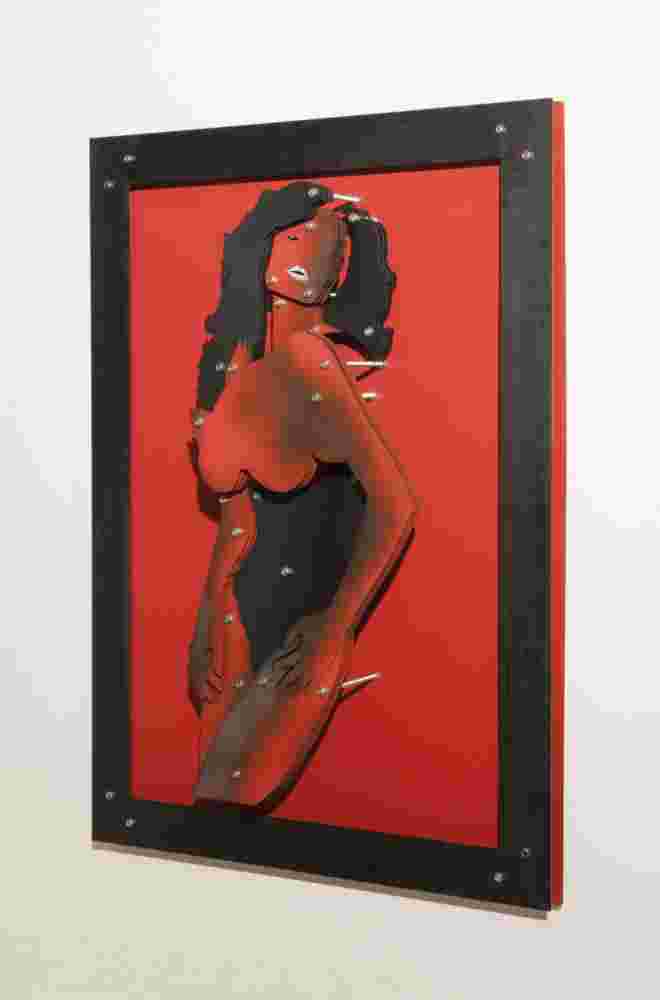 Red wall installation of a woman made of multi layers of black and colored steel.