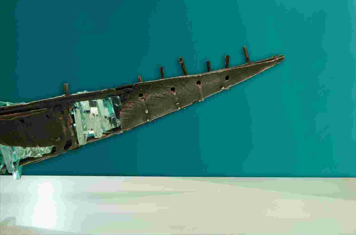 Shipwreck boat sculpture made of hand cut glass and bronze.