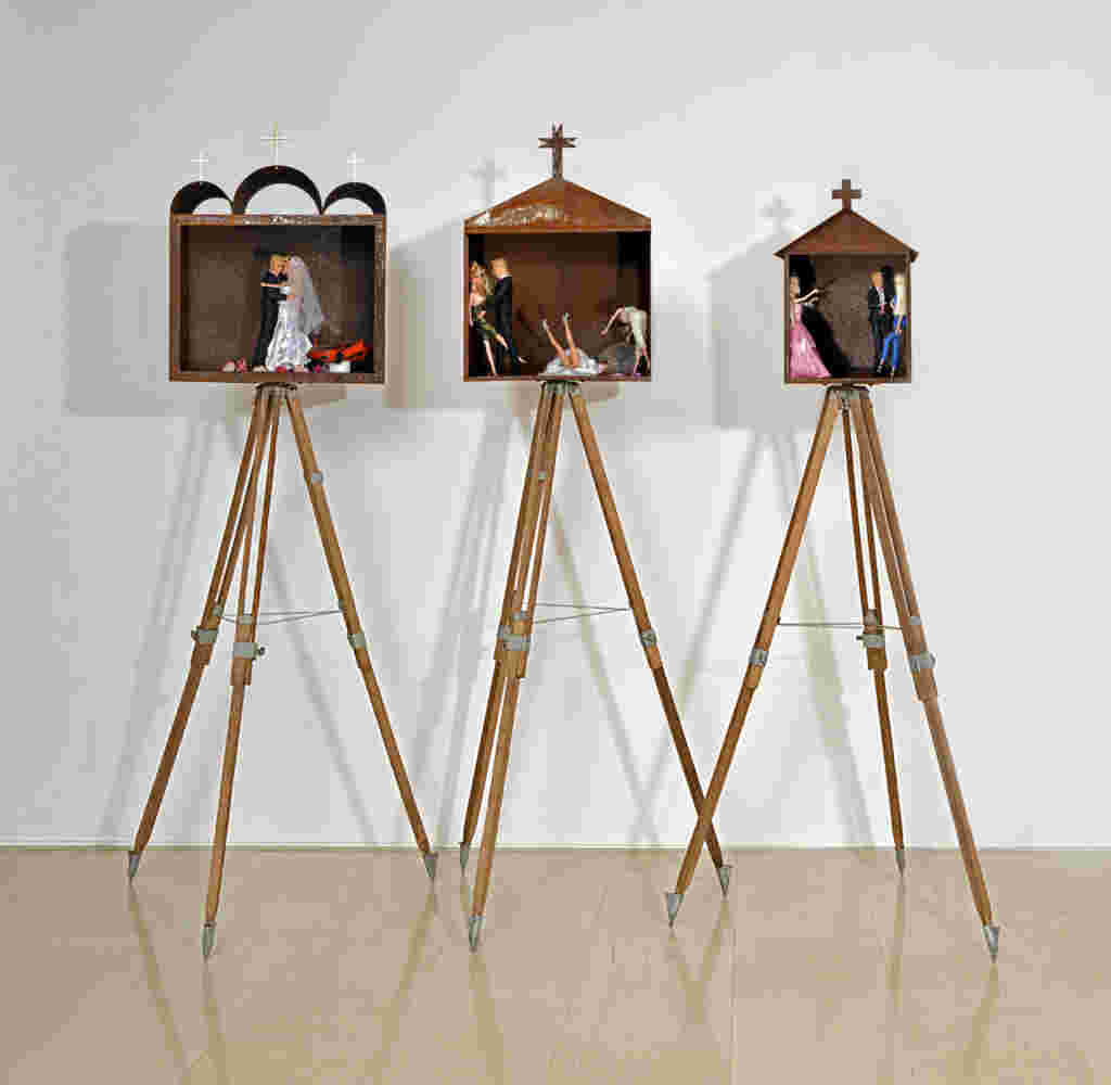 Mixed media art resembling small shrines made of rusted stee, barbies and toys. Related to the themes of vanity and religion.
