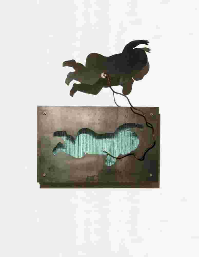 Wall sculpture made of iron and glass of a baby flying