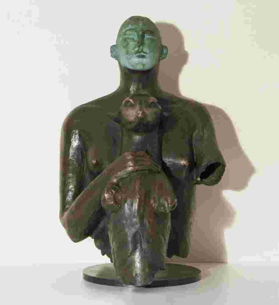 Bronze sculpture of a woman holding a dog