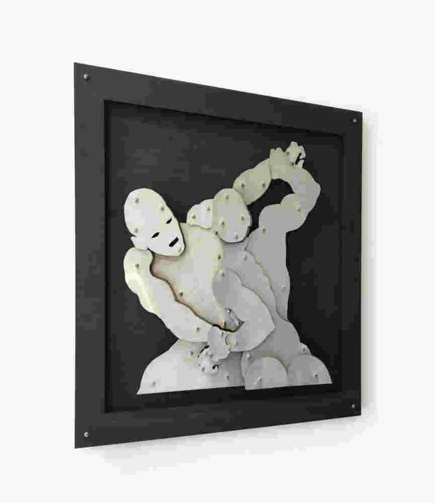 Wall sculpture of two men wrestlers fighting made of steel on black background