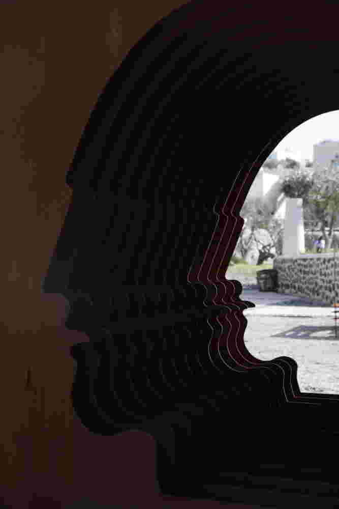 Large-scale exterior art installation – layered face cut-out made from steel.