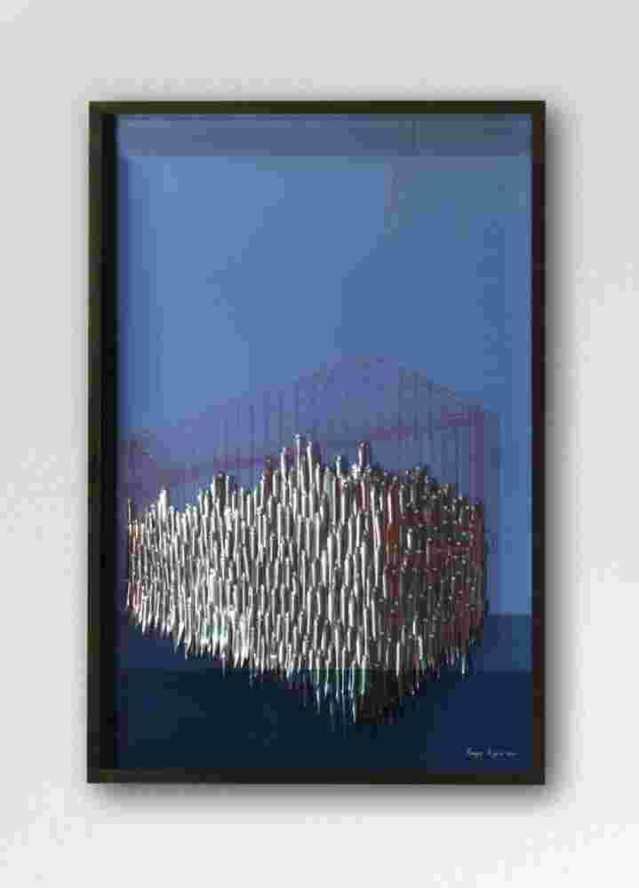 Mixed media wall sculpture of fish being captured in a cage