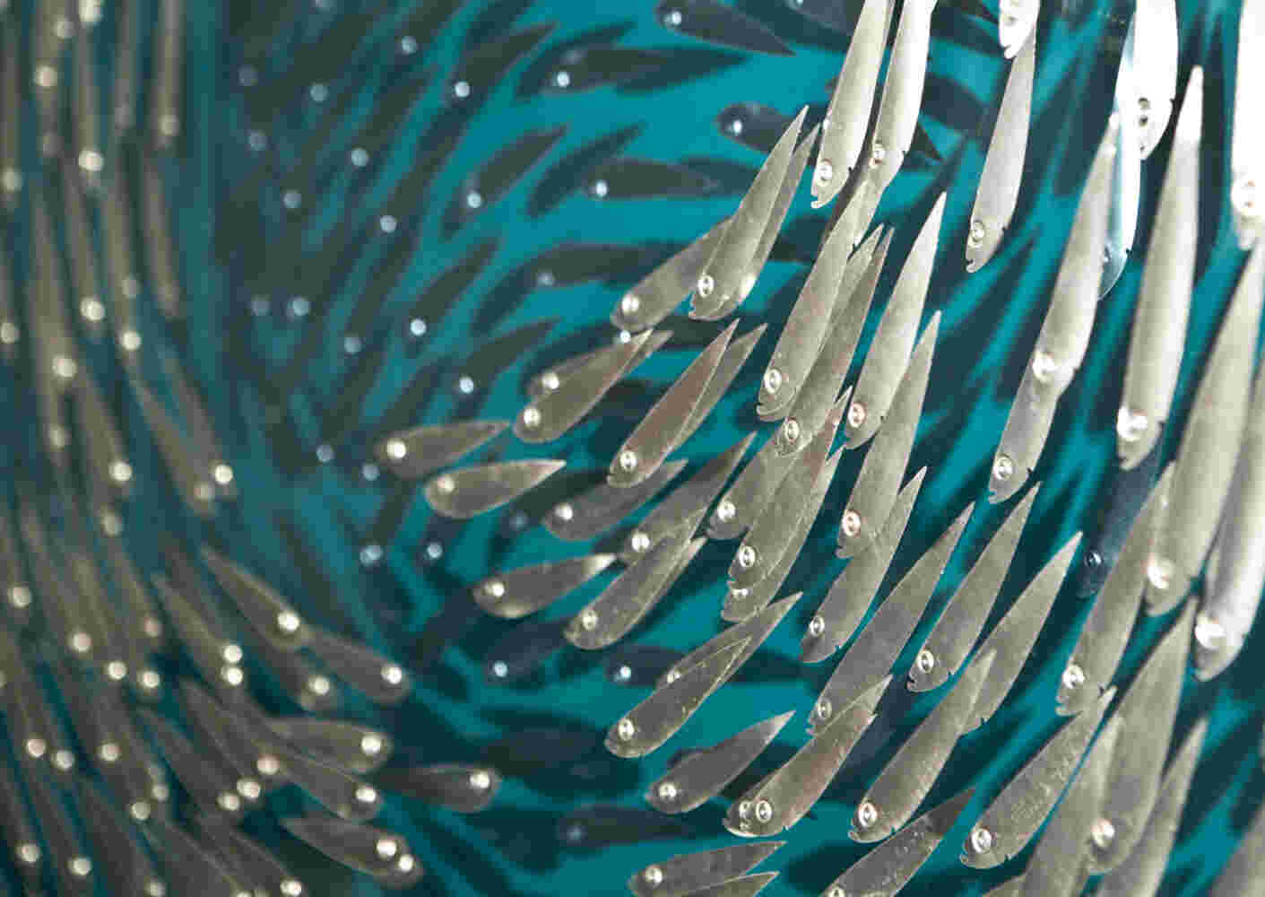 Three-dimensional wall sculpture, school of fish theme, made of aluminum and plexiglass