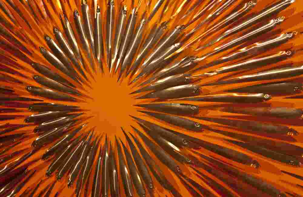 Three-dimensional wall sculpture, school of fish theme, with layers of plexiglass, aluminum frame and an explosion of copper fish.