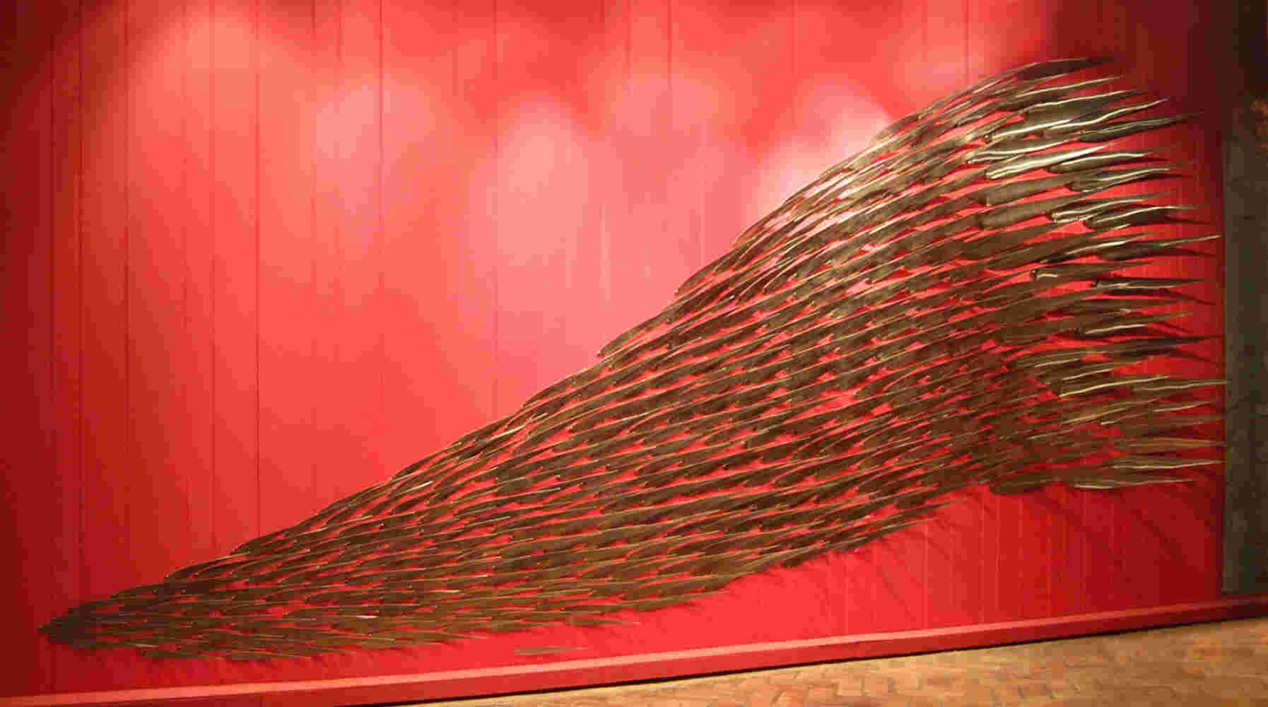 Flowing stainless steel fish art