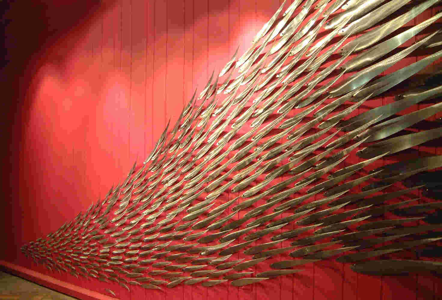 Flowing stainless steel fish art
