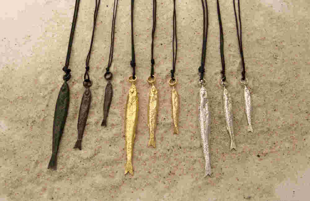 Different sizes and colors of sardine necklaces